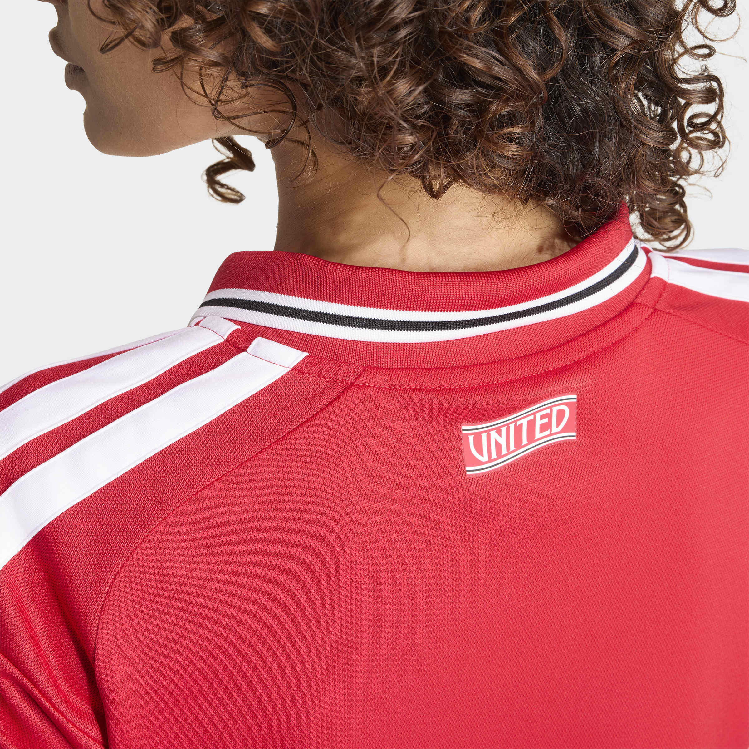 manchester united 2026/27 home shirt, red and white, back view on model