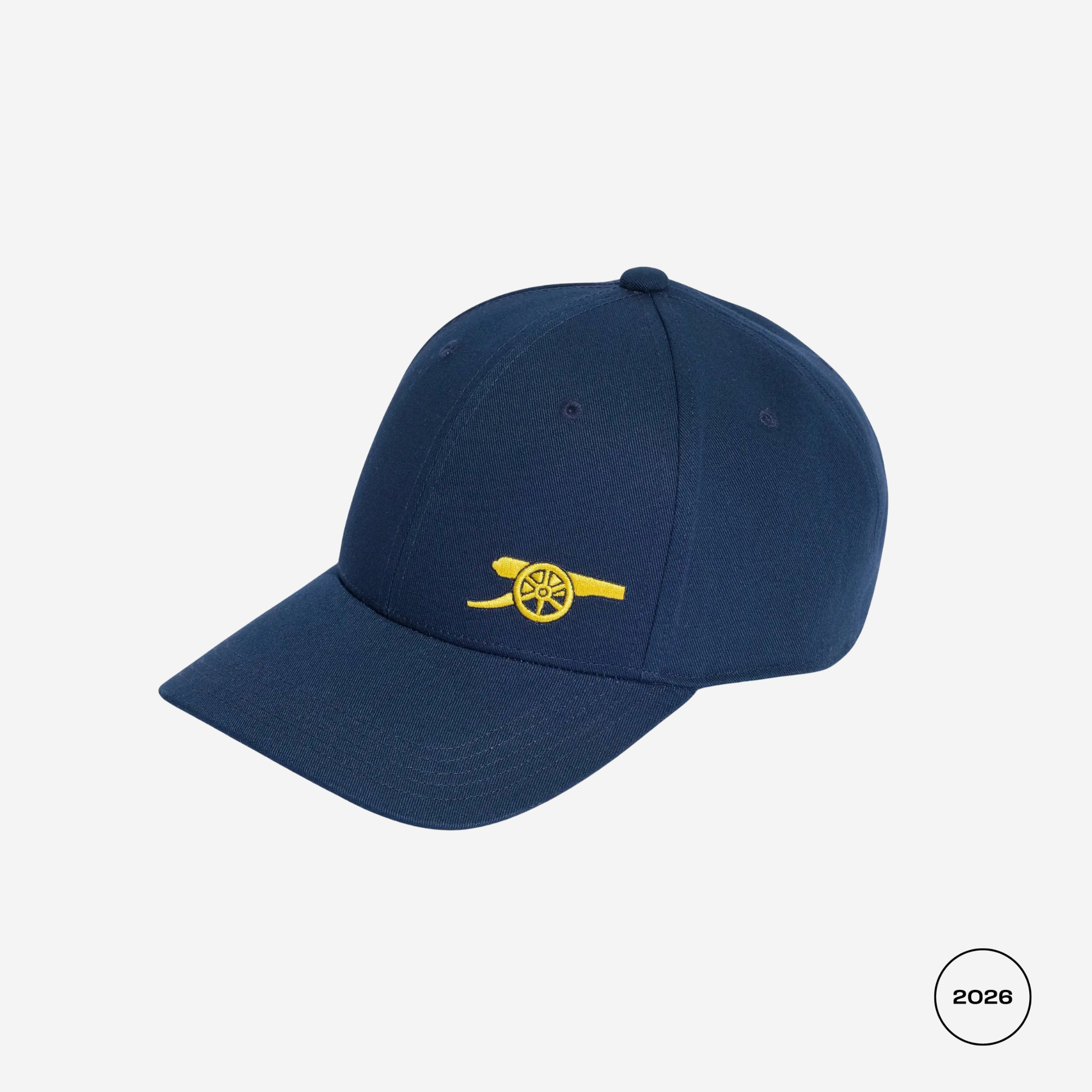 A navy blue baseball cap with a yellow embroidered cannon logo on the front, shown against a light gray background.