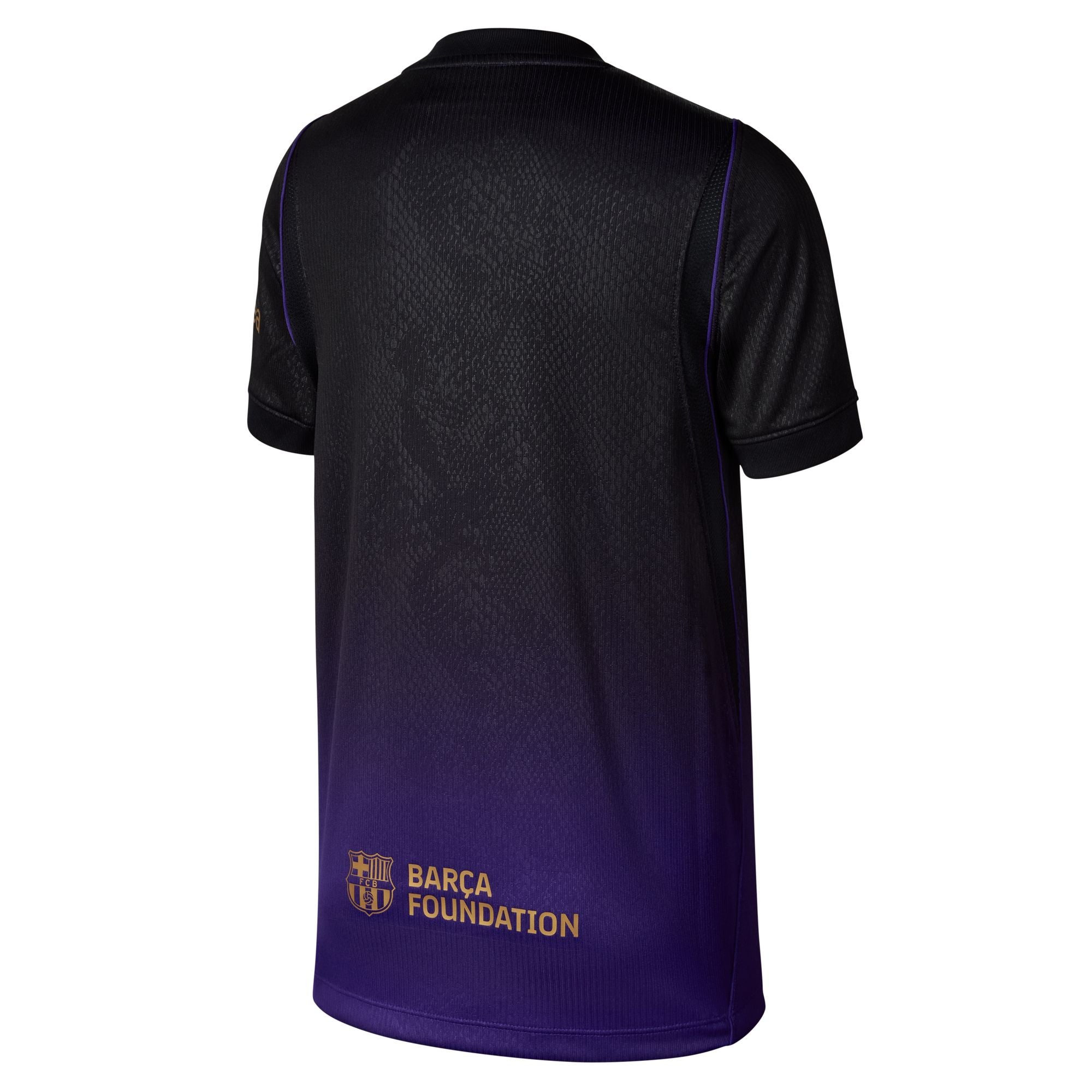 A short-sleeve athletic jersey shown from the back, featuring a black-to-purple gradient design with gold 'BARCA FOUNDATION' text near the lower back.