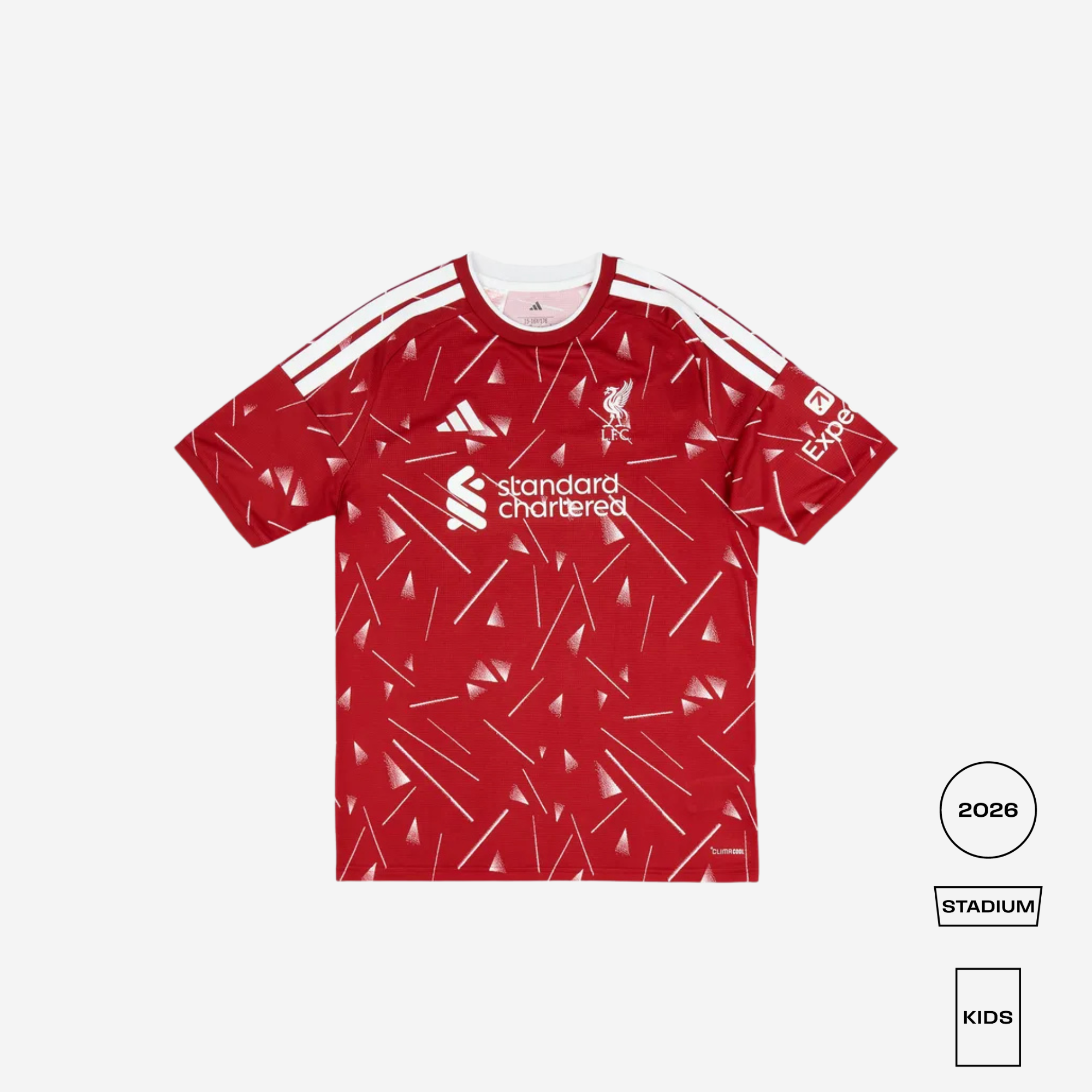 A red short-sleeve football jersey with a white geometric pattern, featuring the Liverpool club crest, white Adidas logo and stripes, and the Standard Chartered sponsor logo. The image is presented on a light gray background with size/style indicators on the bottom right.