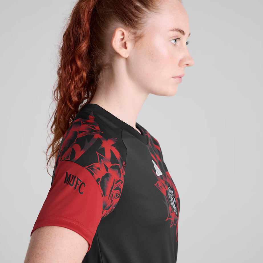 Manchester United 2026/27 pre match shirt, red and white, side view on model