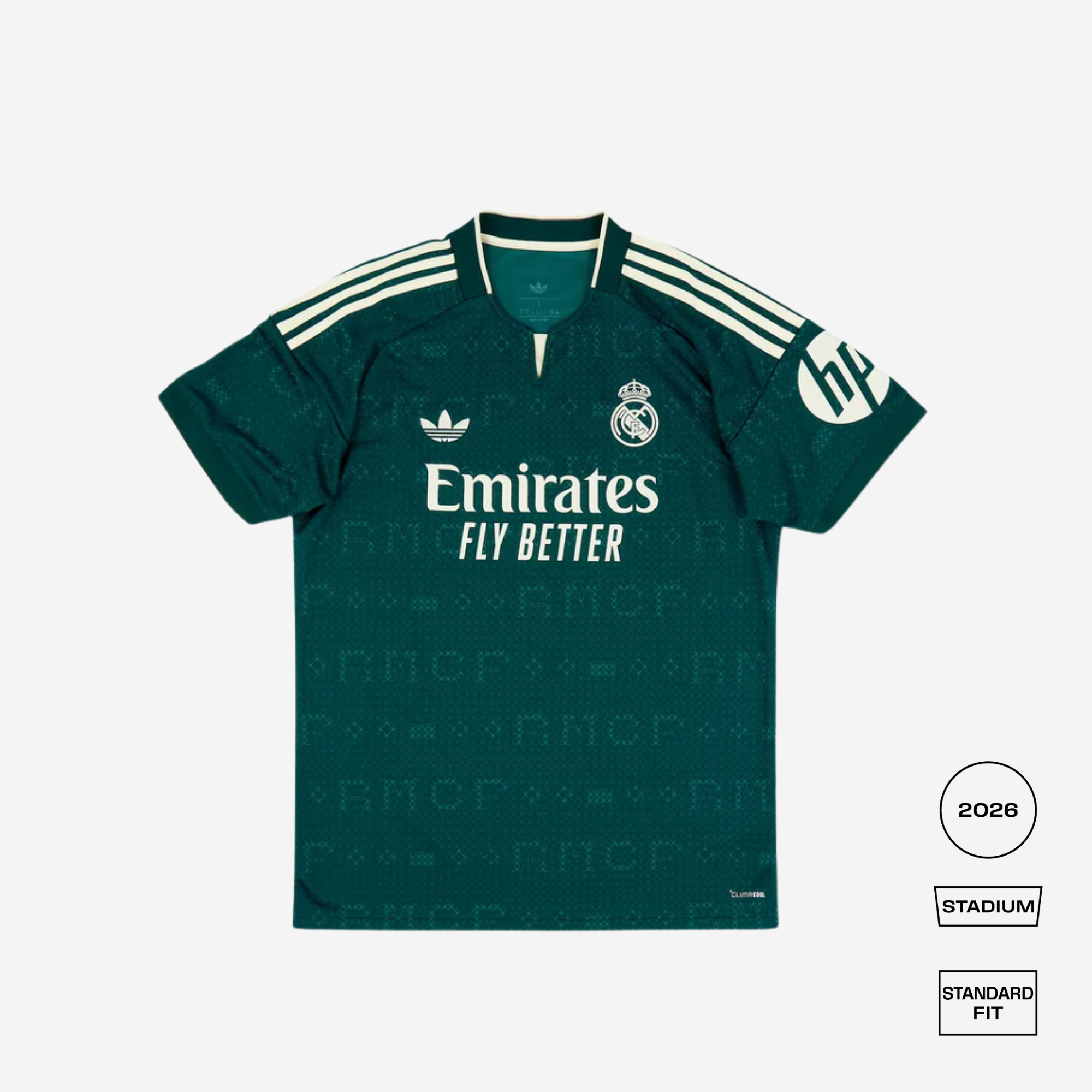 A dark green Real Madrid 2026 Stadium home soccer jersey by Adidas, featuring white branding, the club crest, and the number 66 on the sleeve, displayed against a light gray background with fit and edition badges on the bottom right.